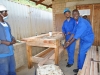Carpenters show off their handmade workbench
